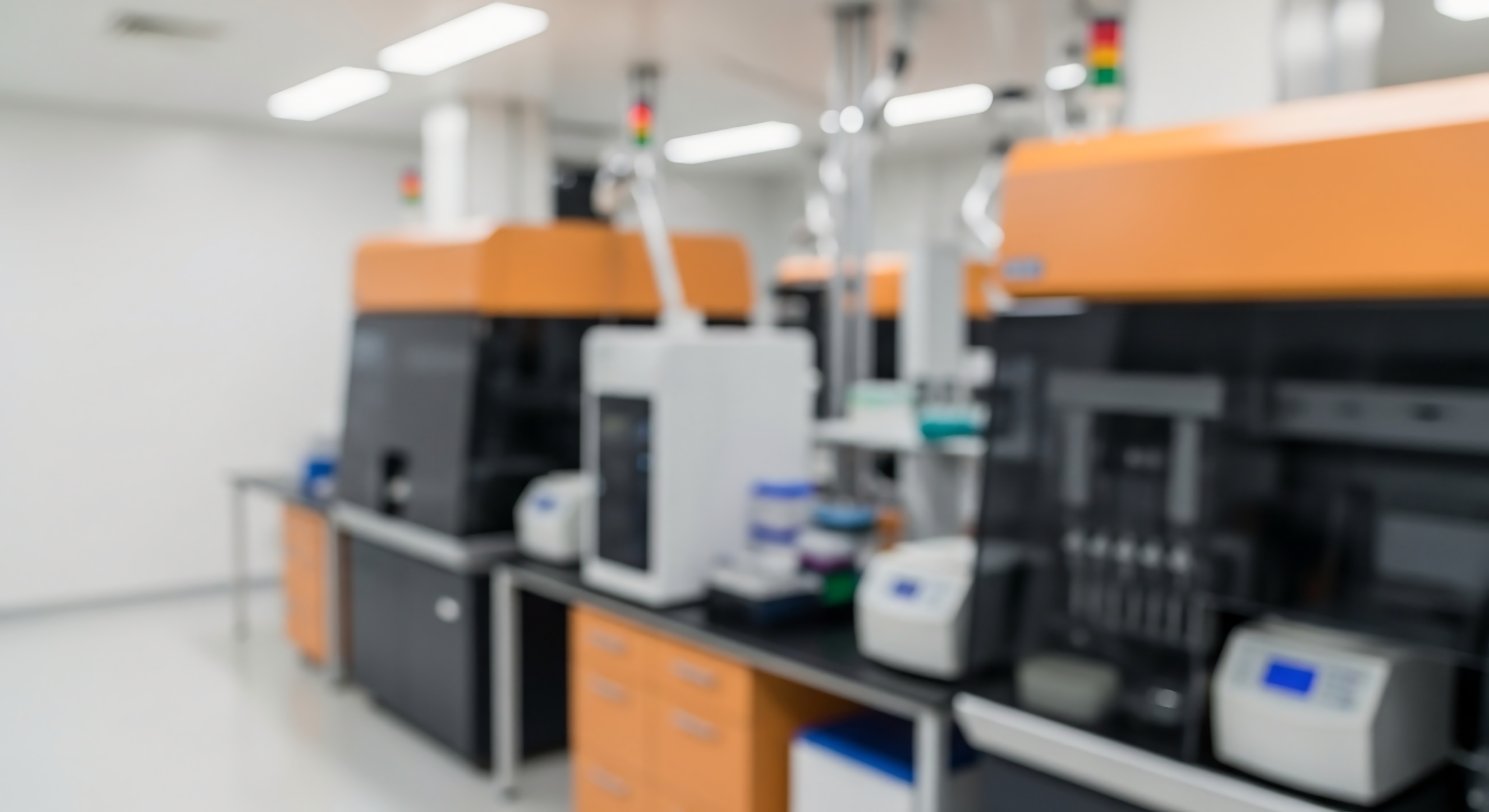 A row of analytical instruments installed along a laboratory bench