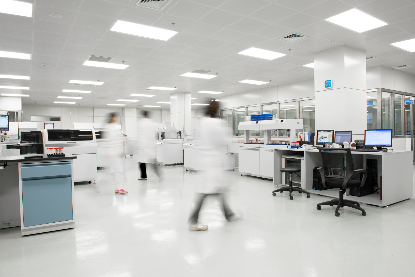 A white laboratory suite with instrumentation along one wall